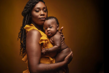 woman holds baby