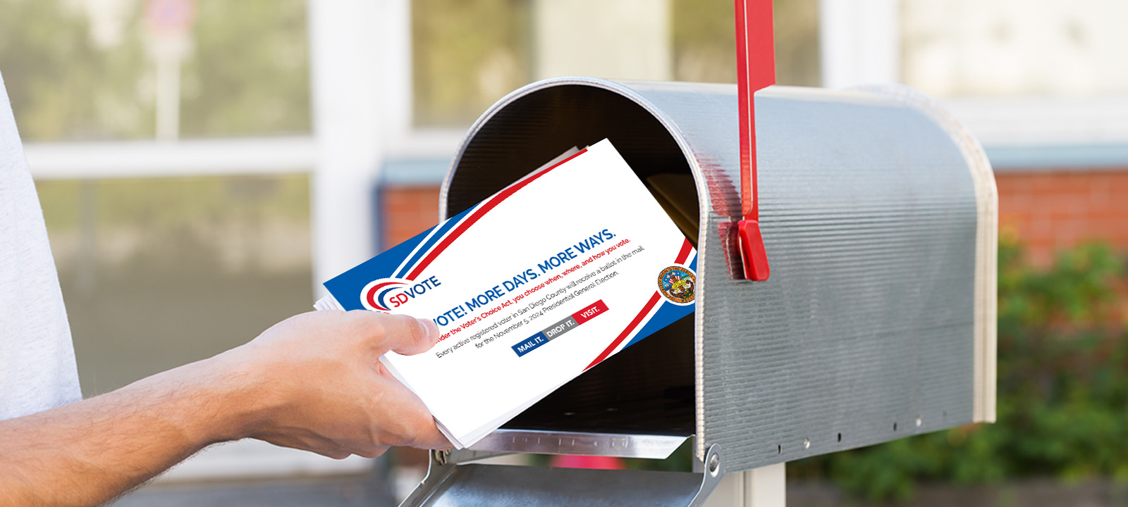 person getting mail out of a mailbox