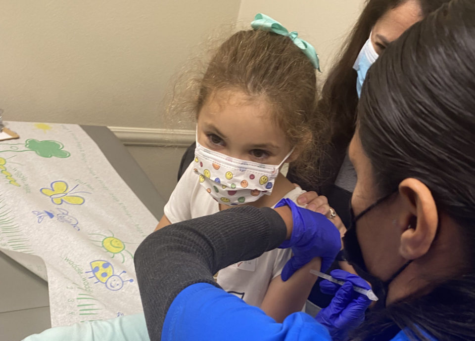 a child getting a COVID-19 vaccine