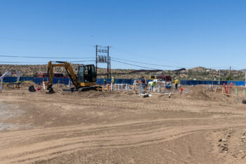 Construction workers working in the dirt on Fire Station 43
