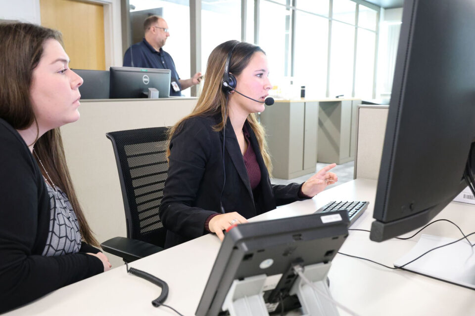 Student with dispatcher documents a simulated emergency call