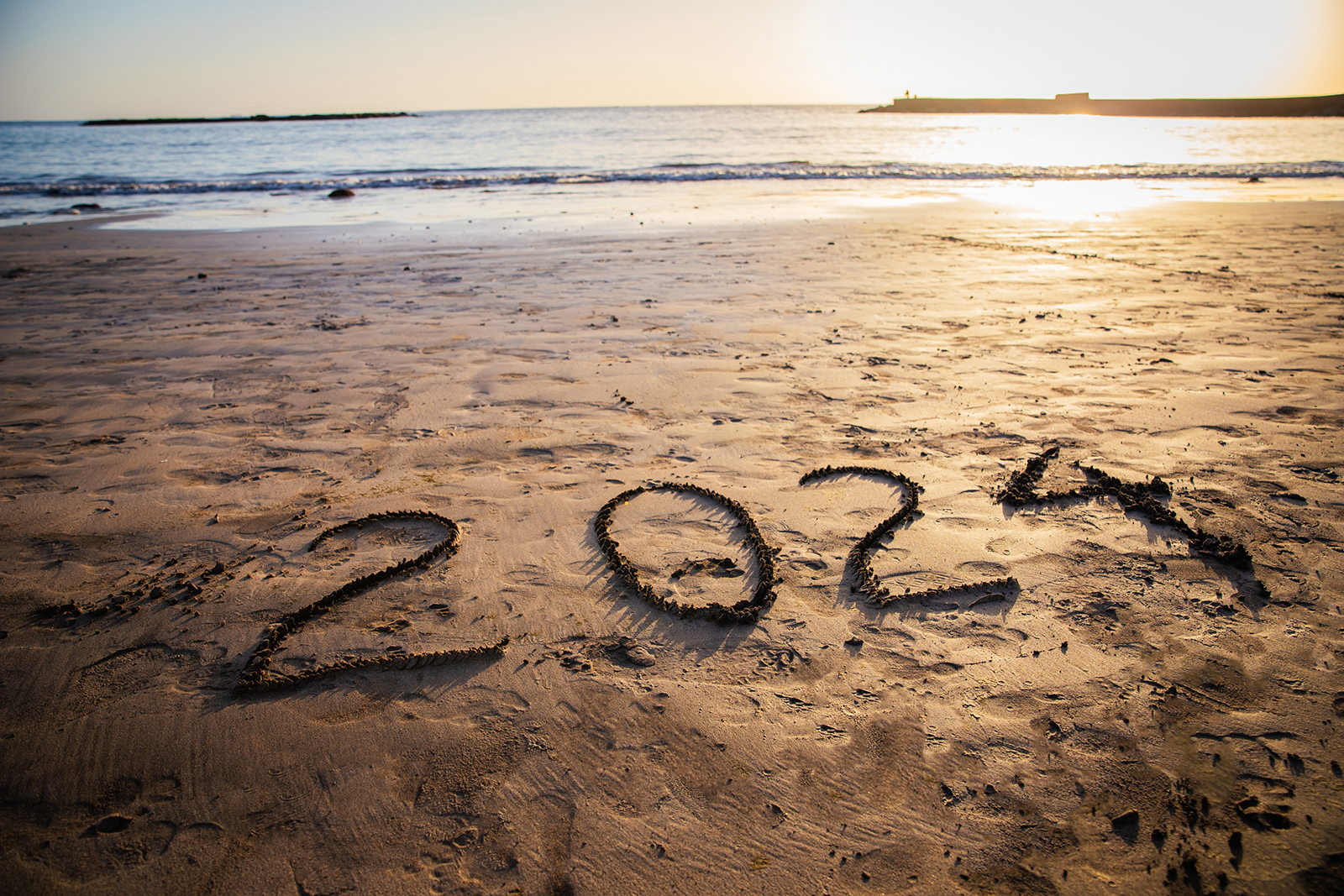 2024 written on the beach