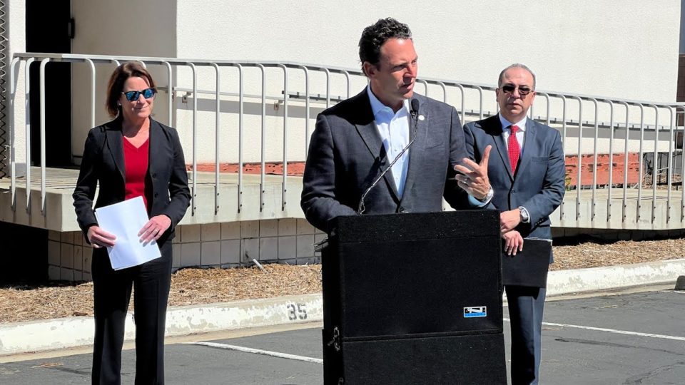 Nathan Fletcher speaks outside a building