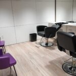 an empty salon with four chairs