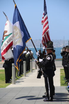 uniformed law enforcement present flags