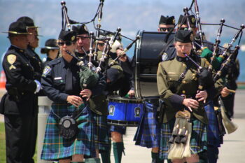 fife and drum line marches along Harbor Drive