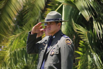 A Border Patrol officer standing salute