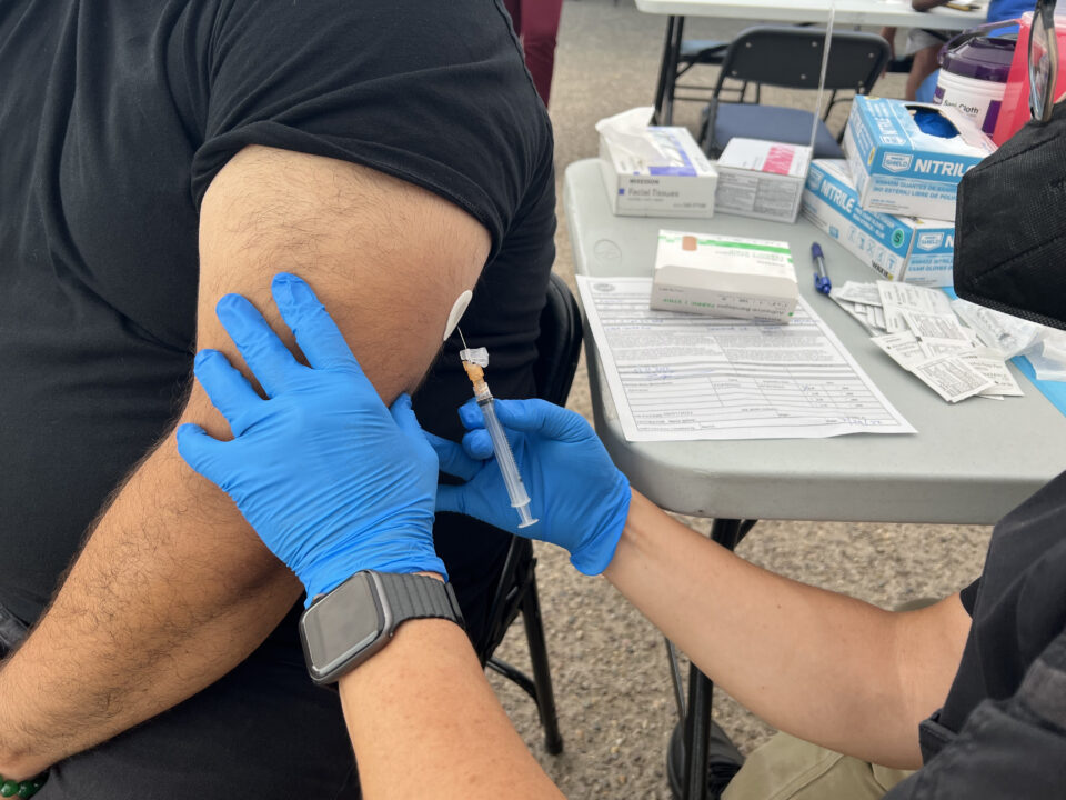 an image of a man getting a monkeypox vaccine