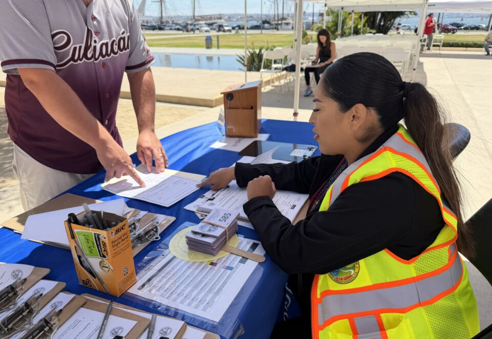 person helping public at apostille event