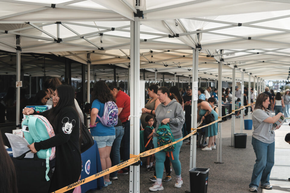 People in line to get backpacks and school supplies