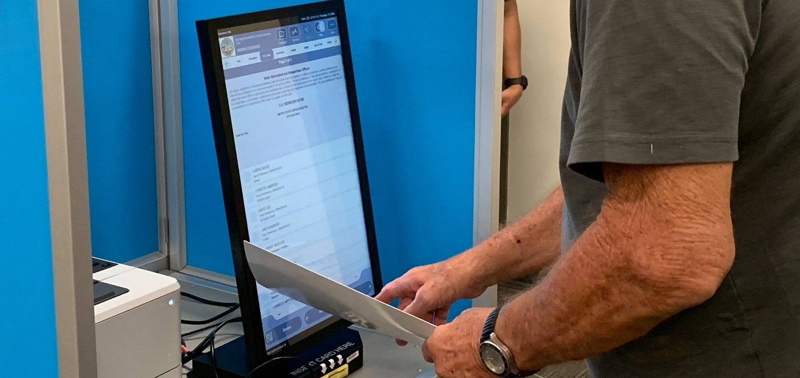 a person using a ballot marking device