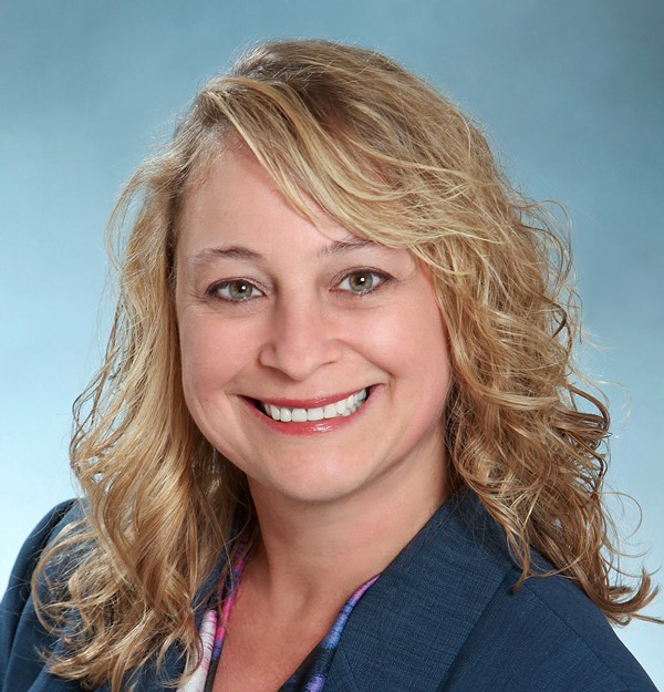 Headshot of Barbara Jimenez in blue blazer