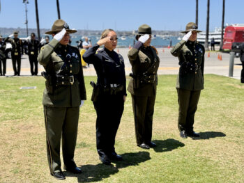 Four officers salute