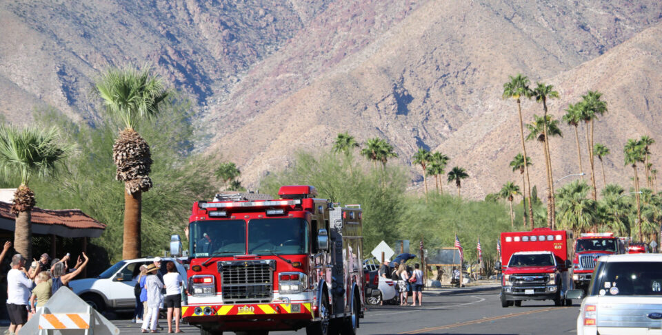 CAL FIRE engine 60 driving through Borrego Springs while onlookers waving at the firefighters