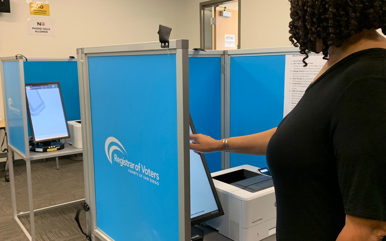 woman using a ballot marking device