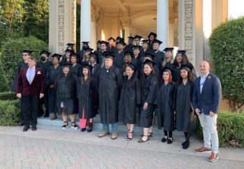 a group of graduates in cap and gown