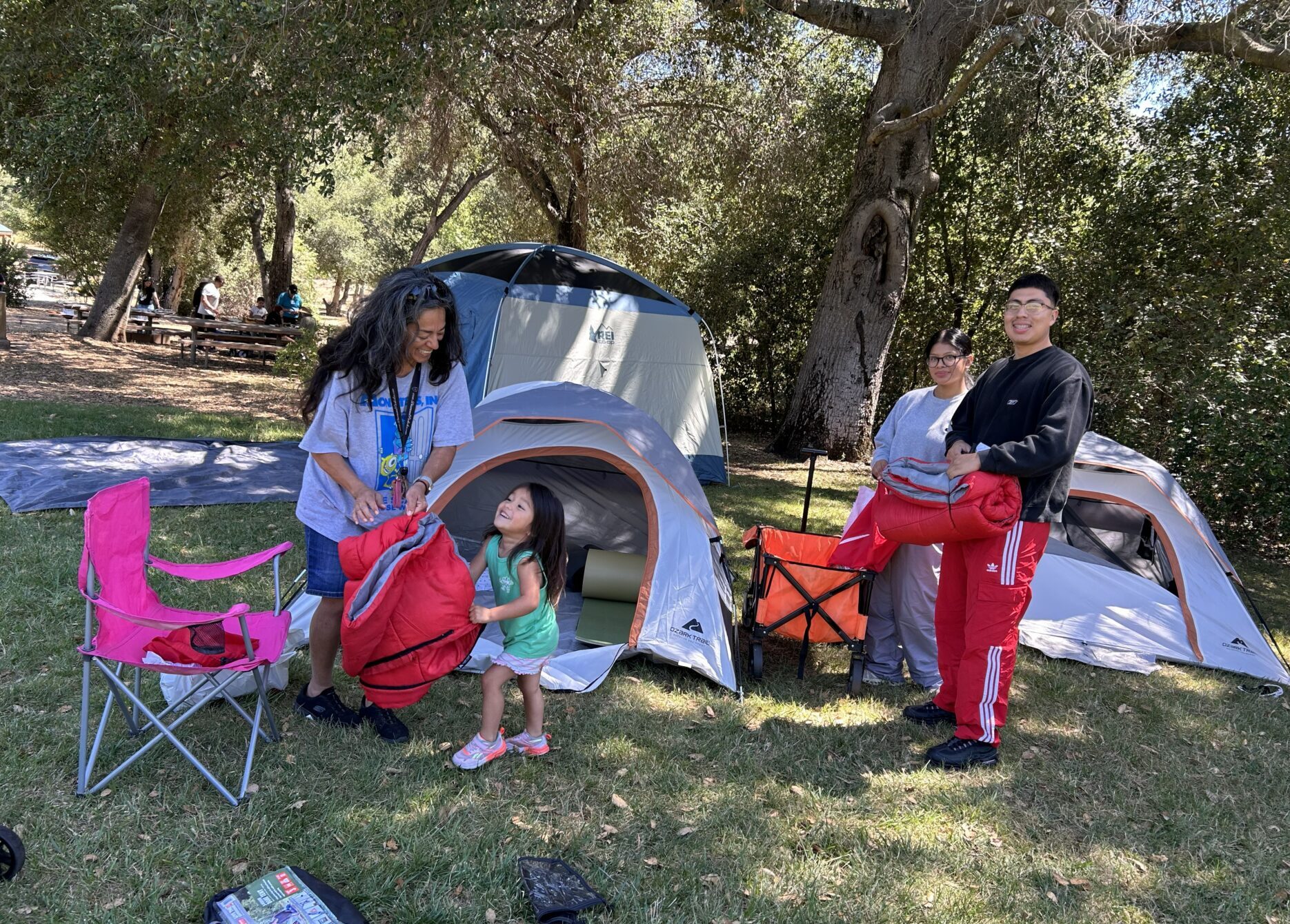 Grandparents and grandkids setting up camp