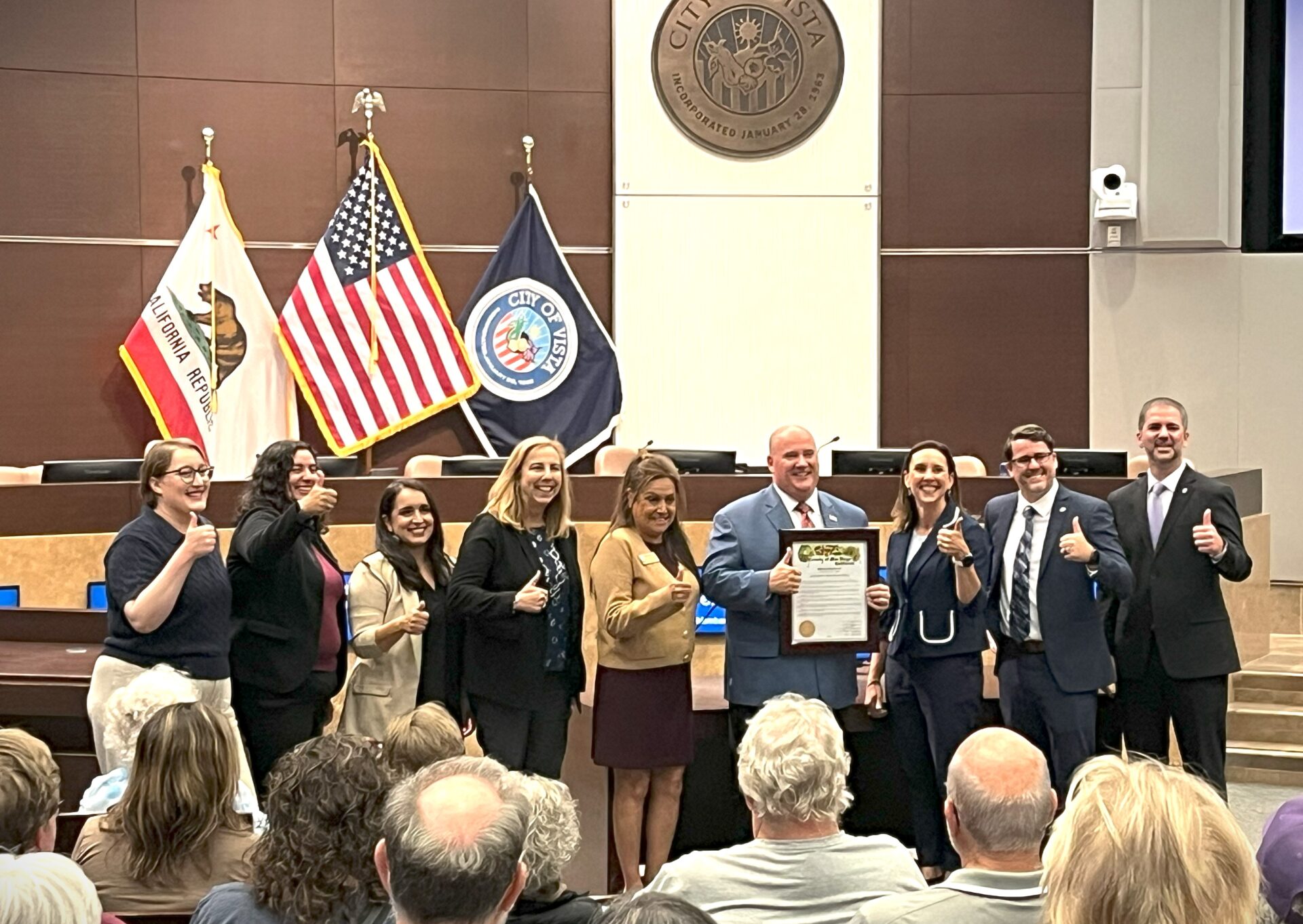 Representatives from the County of San Diego and City of Vista City Council members pose for picture with Live Well San Diego recognition