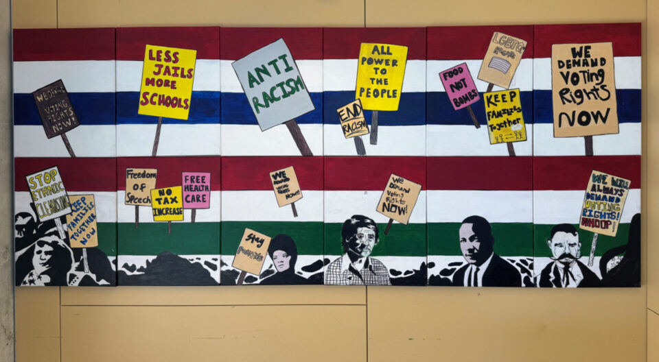 a collage of civil rights leaders hanging on a wall