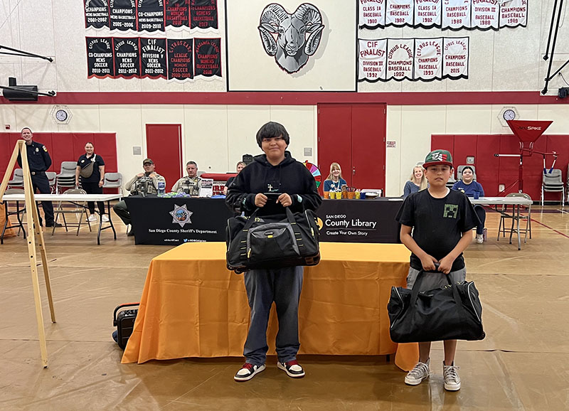 Two boys win family go kit. 