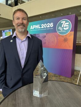 man posing with award