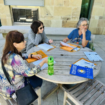 Three women sitting at a table 