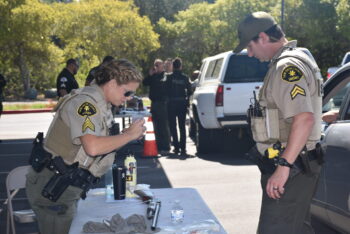 a deputy takes a photo of a gun