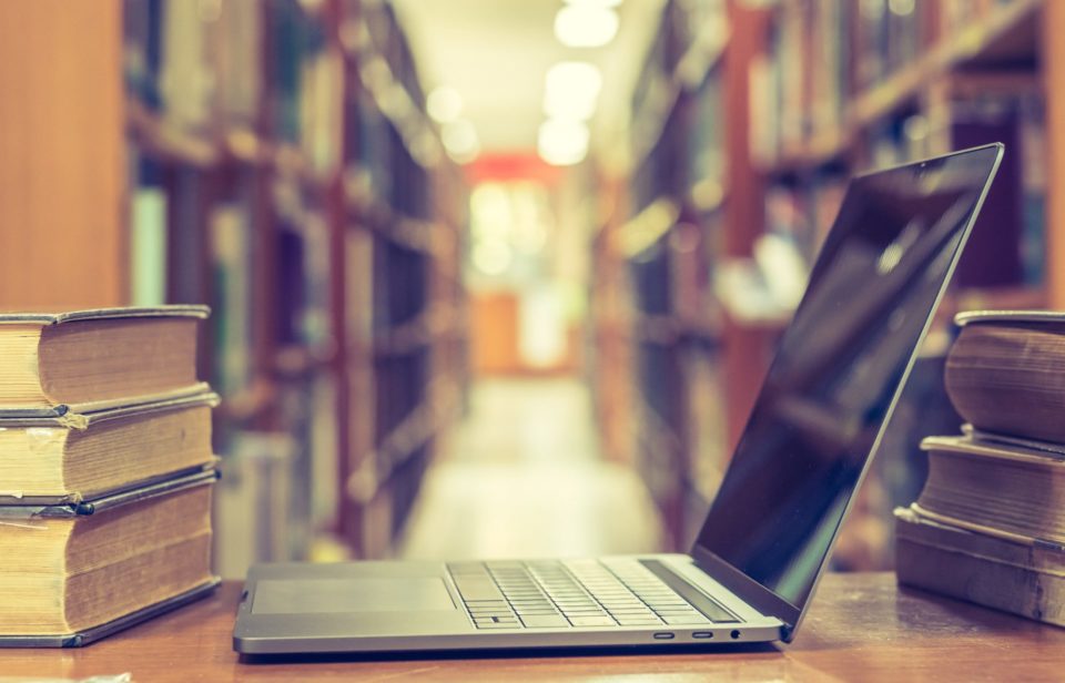 laptop on a table at a library