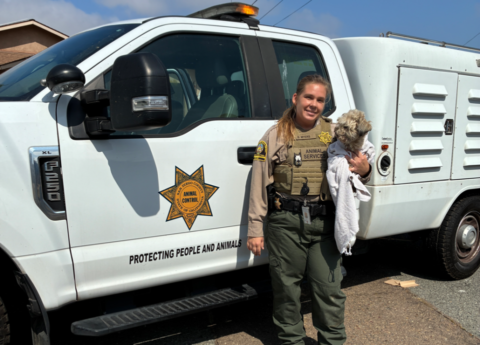 Officer with rescued dog