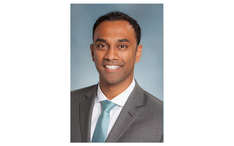 person wearing suit smiles