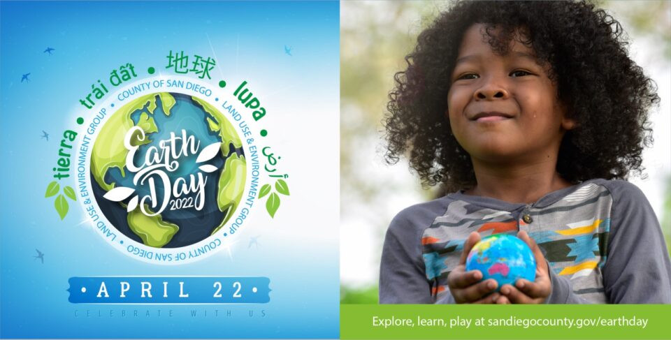 child holds small earth in hands