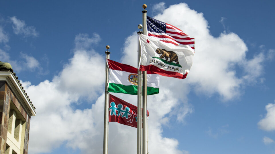 four flags flying in the wind