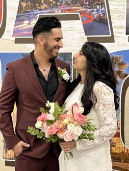 couple faces each other and smiles