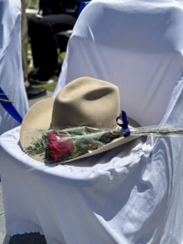 Hat and rose on chair of honor
