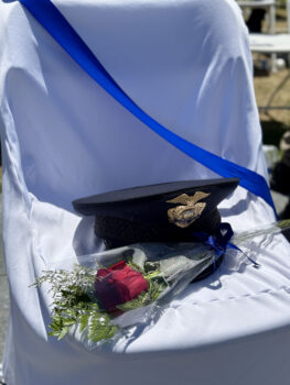 police hat and rose on chair