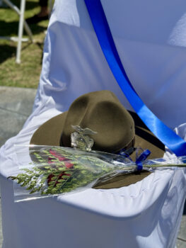 Hat and flower on chair of honor