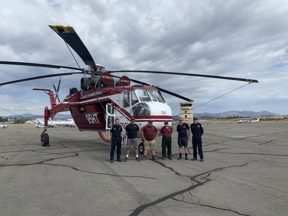 Firefighting helicopter landed on runway with crew