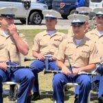 Officers watch memorial ceremony in front of County Administration Center