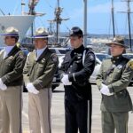 Officers standing at attention in front of County Administration Center