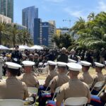 Officers watch memorial ceremony in front of County Administration Center