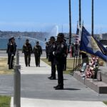 Officers walking up sidewalk in front of County Administration Center