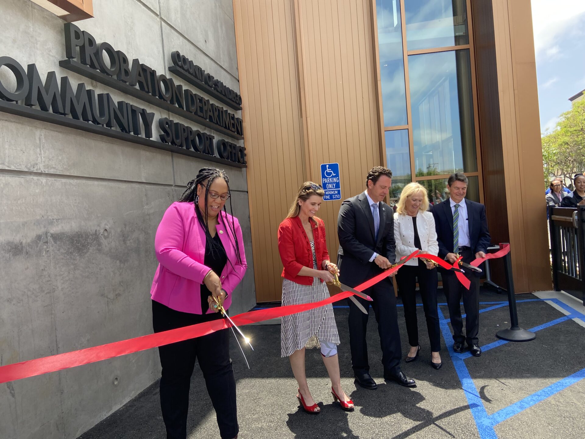 San Diego County officials cut ribbon in front of new Community Support Office building