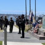 Officers walking up sidewalk in front of County Administration Center