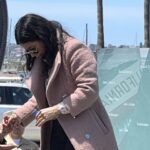 Woman standing in front of memorial wall