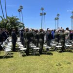 Officers watch memorial ceremony in front of County Administration Center