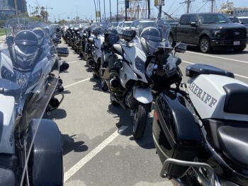 a line of law enforcemtn motorcycles along Harbor Drive