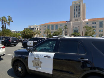 Several Sheriff vehicles parked in front of the CAC