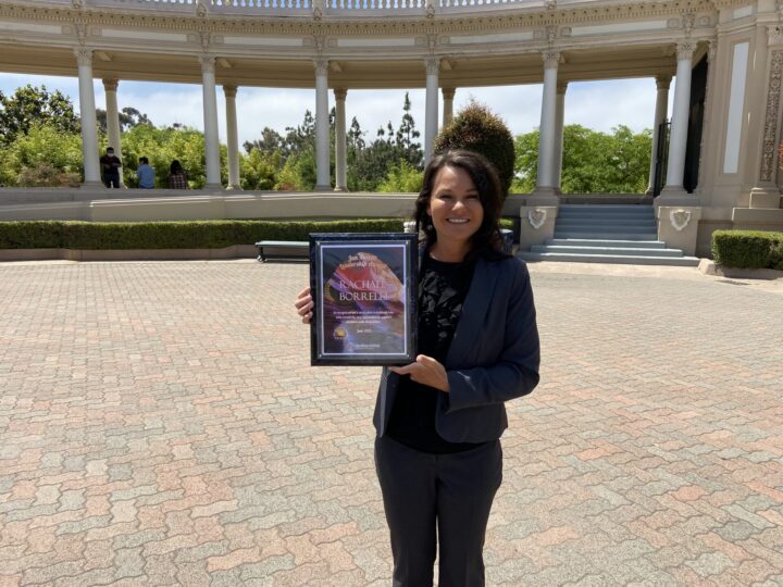 Rachael Borrelli with her Jan Merritt Leadership Award plaque at Balboa Park