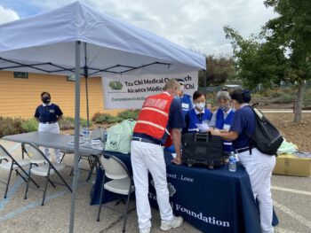 Tzu Chi Medical Outreach team gather around a table