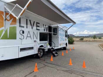 Live Well mobile office set up in a parking lot